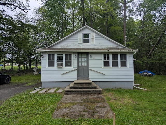 25 Birch St, Pine Bush, NY 12721 - bungalow-style house featuring a front yard, cooling unit, and a shingled roof