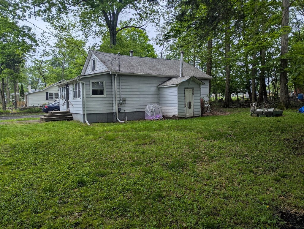 25 Birch St, Pine Bush, NY 12721 - back of property featuring a lawn and roof with shingles