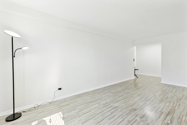88-09 35th Ave Unit 5K, Jackson Heights, NY 11372 - unfurnished room featuring light wood-style floors and baseboards