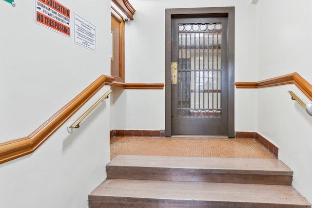 88-09 35th Ave Unit 5K, Jackson Heights, NY 11372 - staircase featuring baseboards