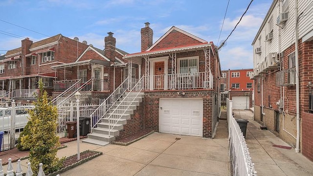 3217 Tenbroeck Ave, Bronx, NY 10469 - multi unit property featuring brick siding, concrete driveway, an attached garage, a chimney, and cooling unit