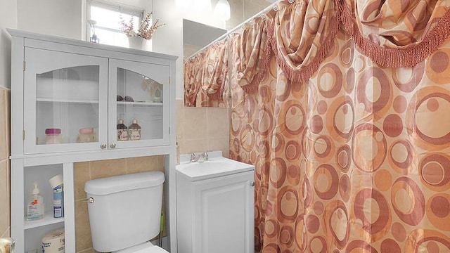 3217 Tenbroeck Ave, Bronx, NY 10469 - full bath with toilet, tile walls, vanity, and curtained shower