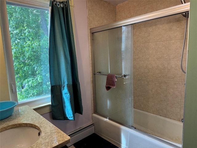 39 Crescent Pl, Middletown, NY 10940 - full bathroom with baseboard heating, combined bath / shower with glass door, and double vanity