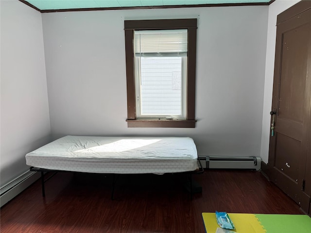 39 Crescent Pl, Middletown, NY 10940 - bedroom with a baseboard heating unit, wood finished floors, and baseboards