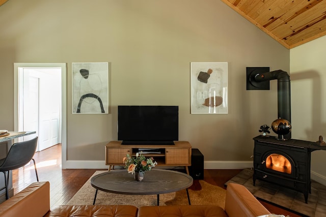 235 Terwilliger Rd, Livingston Manor, NY 12758 - living area featuring a wood stove, wood ceiling, baseboards, high vaulted ceiling, and hardwood / wood-style floors