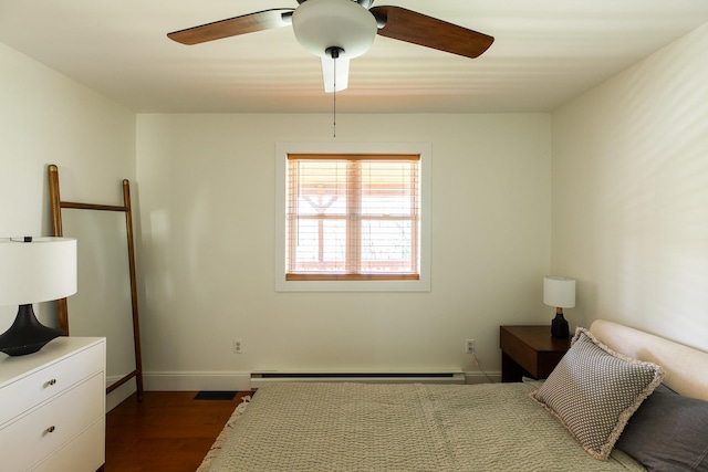 235 Terwilliger Rd, Livingston Manor, NY 12758 - bedroom featuring dark wood-style floors, a baseboard radiator, baseboards, and a ceiling fan