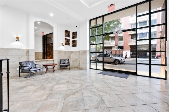 728 Ocean View Ave Unit A2, Brooklyn, NY 11235 - community lobby with tile walls, a wainscoted wall, and recessed lighting