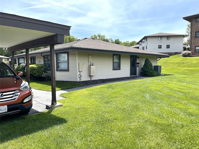 6DEVONCOURT Devon Unit B, Yorktown Heights, NY 10598 - view of home's exterior featuring a lawn, central AC unit, and roof with shingles