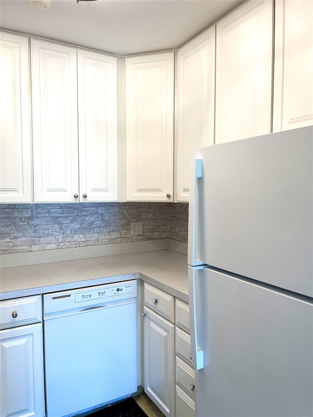 6DEVONCOURT Devon Unit B, Yorktown Heights, NY 10598 - kitchen featuring white appliances, white cabinetry, tasteful backsplash, and light countertops