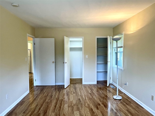 6DEVONCOURT Devon Unit B, Yorktown Heights, NY 10598 - unfurnished bedroom featuring wood finished floors, multiple closets, and baseboards
