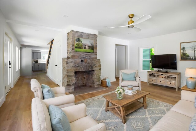 300 Seminary Hill Rd, Carmel, NY 10512 - living room with wood finished floors, a fireplace, and a ceiling fan