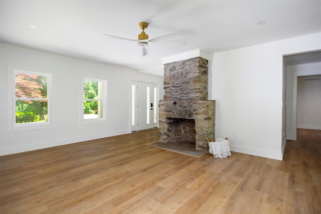 300 Seminary Hill Rd, Carmel, NY 10512 - unfurnished living room with wood finished floors, ceiling fan, baseboards, and a fireplace