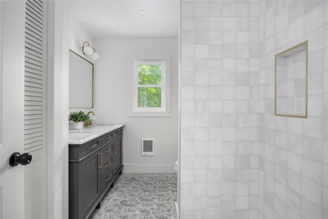 300 Seminary Hill Rd, Carmel, NY 10512 - bathroom featuring double vanity, heating unit, baseboards, and toilet