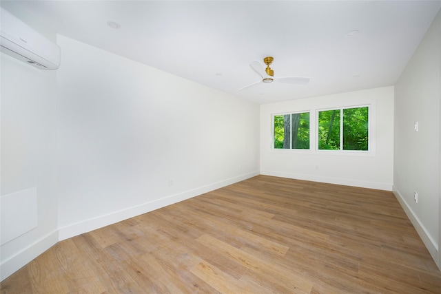300 Seminary Hill Rd, Carmel, NY 10512 - spare room with a wall mounted air conditioner, baseboards, light wood-type flooring, and a ceiling fan