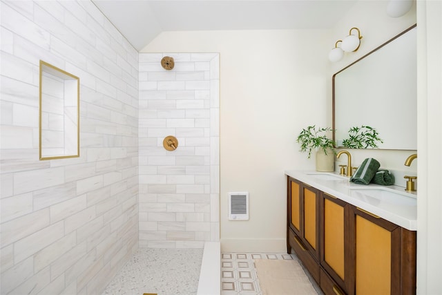 300 Seminary Hill Rd, Carmel, NY 10512 - full bathroom featuring a tile shower, double vanity, and baseboards