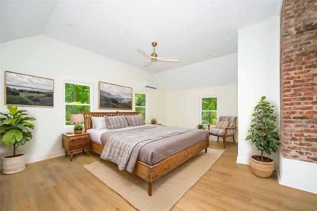 300 Seminary Hill Rd, Carmel, NY 10512 - bedroom featuring vaulted ceiling, light wood-type flooring, a wall mounted AC, a ceiling fan, and baseboards