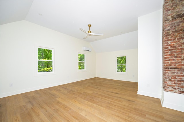 300 Seminary Hill Rd, Carmel, NY 10512 - spare room with vaulted ceiling, an AC wall unit, light wood finished floors, and ceiling fan