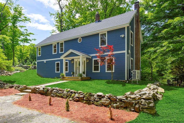 300 Seminary Hill Rd, Carmel, NY 10512 - view of front of house featuring a chimney, a front yard, a cooling unit, and roof with shingles
