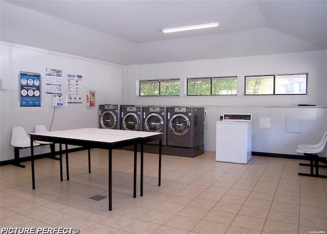 8 Cedar Ct Unit 8, Selden, NY 11784 - shared laundry with washer and dryer and light tile patterned floors