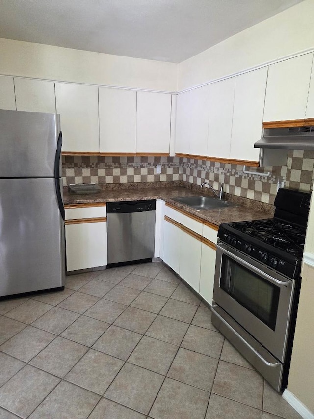 8 Cedar Ct Unit 8, Selden, NY 11784 - kitchen featuring appliances with stainless steel finishes, a sink, under cabinet range hood, tasteful backsplash, and white cabinets