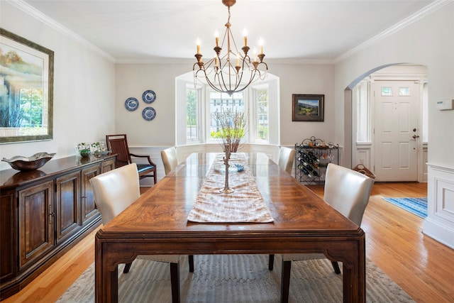 21 Deepdale Dr, Manhasset, NY 11030 - dining room with a chandelier, arched walkways, light wood finished floors, and ornamental molding