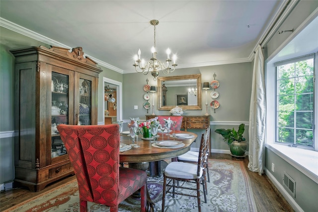 28 Valley Rd, Manhasset, NY 11030 - dining room with healthy amount of natural light, wood finished floors, a chandelier, ornamental molding, and baseboards