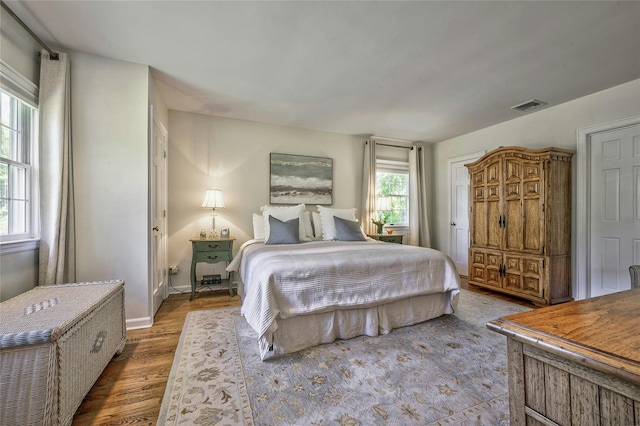28 Valley Rd, Manhasset, NY 11030 - bedroom featuring wood finished floors, radiator heating unit, and baseboards