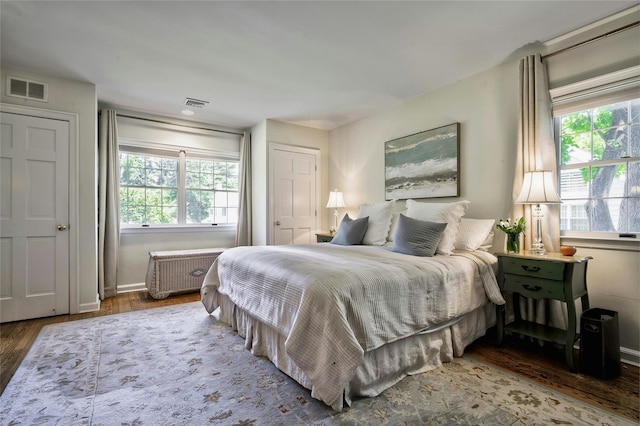 28 Valley Rd, Manhasset, NY 11030 - bedroom featuring wood finished floors, multiple windows, and baseboards