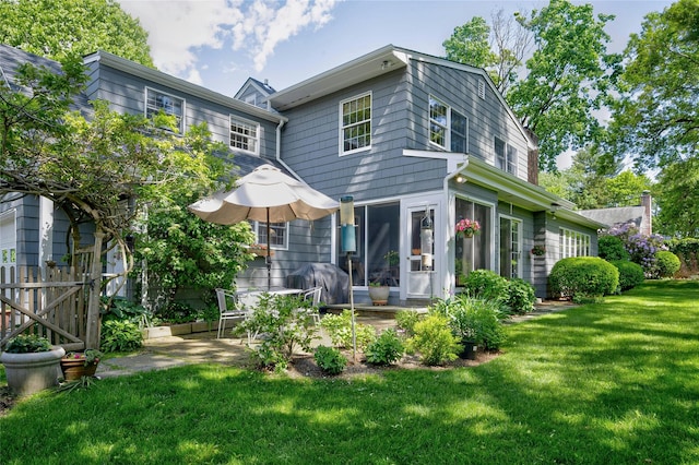 28 Valley Rd, Manhasset, NY 11030 - rear view of house with a patio area and a sunroom