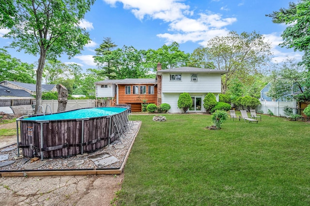 40 Monroe Ave, Brentwood, NY 11717 - rear view of property with a chimney
