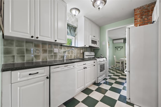 45-31 169th St, Flushing, NY 11358 - kitchen with white appliances, light floors, a sink, and white cabinetry