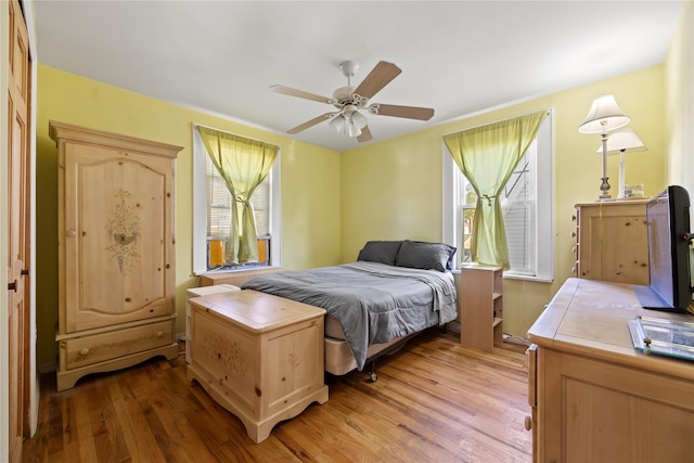 45-31 169th St, Flushing, NY 11358 - bedroom featuring multiple windows, light wood-type flooring, and ceiling fan