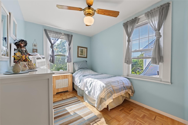 45-31 169th St, Flushing, NY 11358 - bedroom with radiator heating unit, baseboards, and ceiling fan