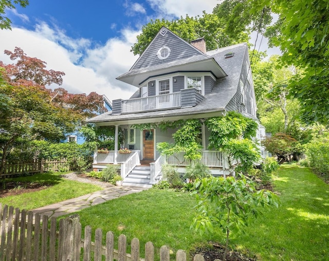 51 Belden Ave, Dobbs Ferry, NY 10522 - victorian home with a balcony, a porch, and roof with shingles