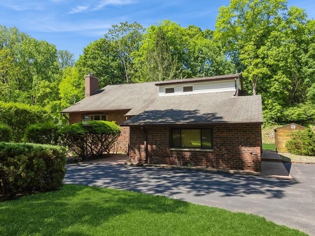 3 Brookland Farms Rd, Poughkeepsie, NY 12601 - view of front of property with a chimney, roof with shingles, and brick siding