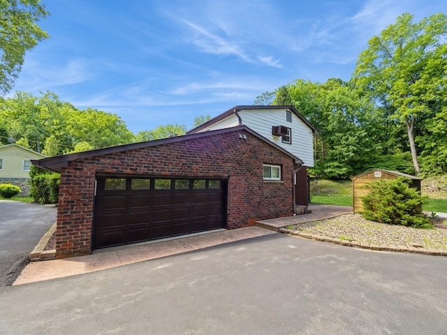 3 Brookland Farms Rd, Poughkeepsie, NY 12601 - view of property exterior with brick siding, driveway, and a garage