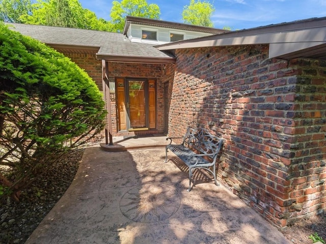 3 Brookland Farms Rd, Poughkeepsie, NY 12601 - doorway to property with brick siding and roof with shingles