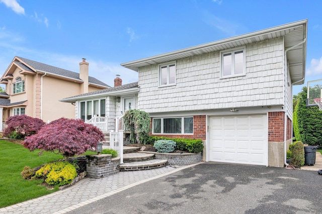 19 Alan Ct, Plainview, NY 11803 - tri-level home with a garage, brick siding, driveway, and a chimney