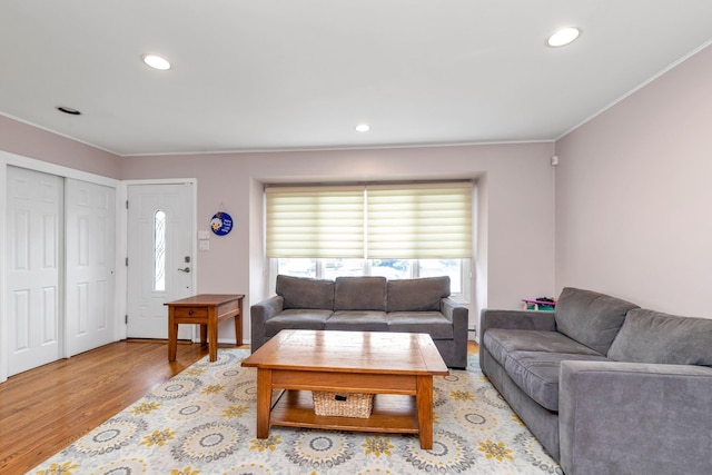 19 Alan Ct, Plainview, NY 11803 - living area featuring light wood-style floors, plenty of natural light, ornamental molding, and recessed lighting