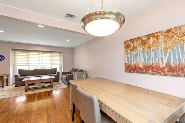 19 Alan Ct, Plainview, NY 11803 - dining area featuring wood finished floors, ornamental molding, and recessed lighting