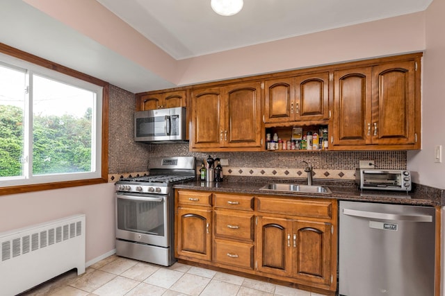 19 Alan Ct, Plainview, NY 11803 - kitchen with stainless steel appliances, radiator, a sink, and backsplash