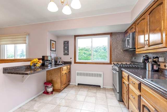 19 Alan Ct, Plainview, NY 11803 - kitchen featuring radiator, stainless steel appliances, brown cabinetry, a chandelier, and baseboards