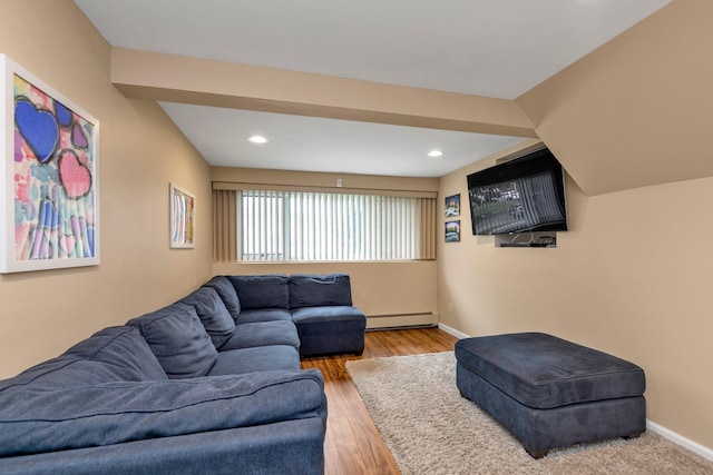 19 Alan Ct, Plainview, NY 11803 - living room with a baseboard heating unit, recessed lighting, wood finished floors, and baseboards