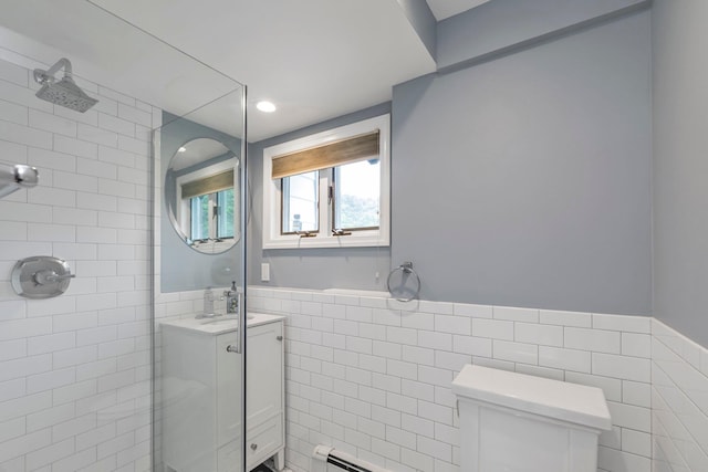 19 Alan Ct, Plainview, NY 11803 - bathroom featuring tile walls, a tile shower, vanity, toilet, and a wainscoted wall