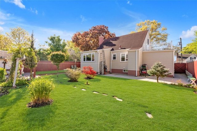 597 Stratford Rd, Baldwin, NY 11510 - rear view of property featuring a patio area and a chimney