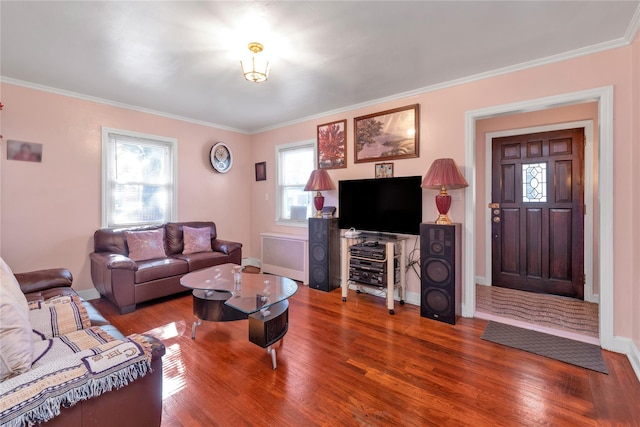 597 Stratford Rd, Baldwin, NY 11510 - living area with radiator, wood finished floors, ornamental molding, and baseboards