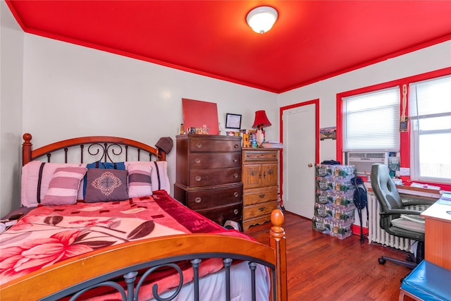 597 Stratford Rd, Baldwin, NY 11510 - bedroom with wood finished floors and cooling unit