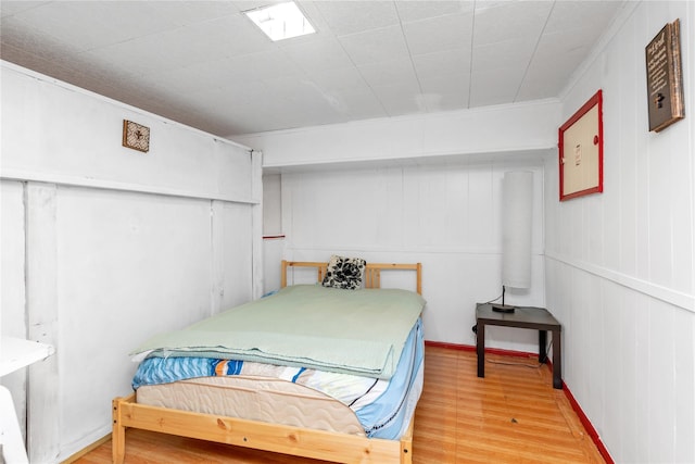 597 Stratford Rd, Baldwin, NY 11510 - bedroom featuring light wood-style floors and crown molding