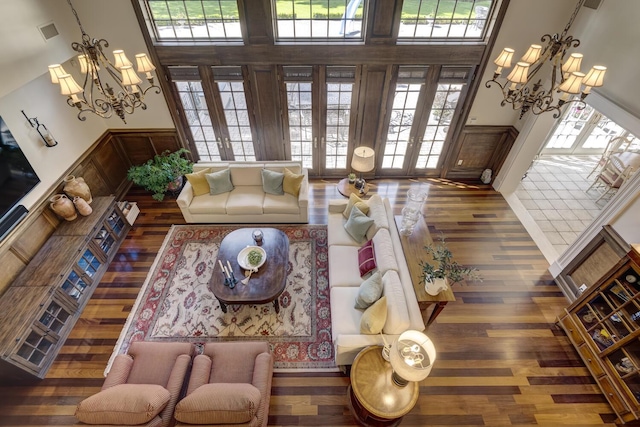 220 Elderfields Rd, Manhasset, NY 11030 - living area with a high ceiling, a chandelier, wood finished floors, and french doors