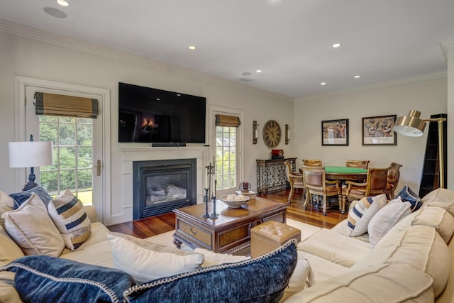 220 Elderfields Rd, Manhasset, NY 11030 - living area with a glass covered fireplace, wood finished floors, crown molding, and recessed lighting